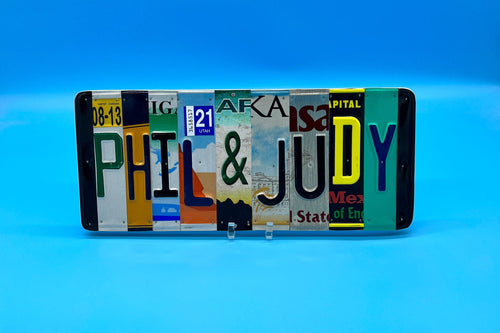 License plate art with 'PHIL & JUDY' on a blue background