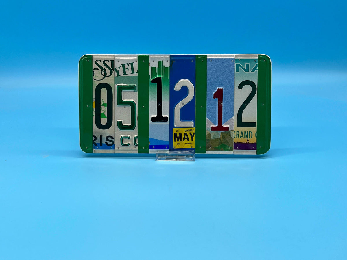 Collection of license plates with various text and colors on a blue background